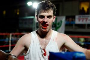 Andrew Kuchta of Sigma Chi & Lord’s Boxing Gym smiling after a hard-fought win. ©Charlie Pearce